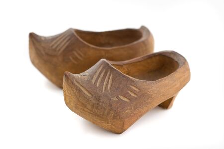 Pair of traditional wooden shoes, on white background.の写真素材
