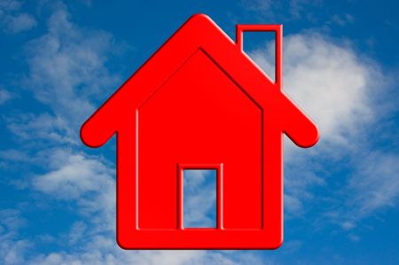 A Red house in the blue sky.の写真素材