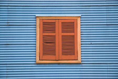 Old window in a traditional house in la boca neighborhood, Buenos Aires.の写真素材