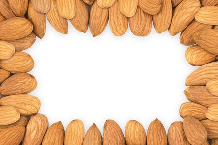 Almond nuts forming a frame, in white backgroundの写真素材