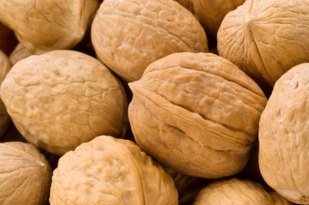 Background of walnuts, close up studio shot.