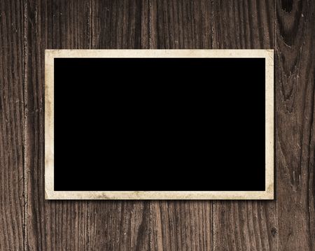 Vintage blank photo on wooden table with copy space. の写真素材