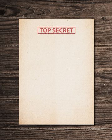 Top secret document on old wooden table.の写真素材