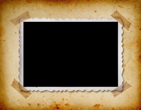 Old photo album page with one old photograph wiht adhesive tape.の写真素材