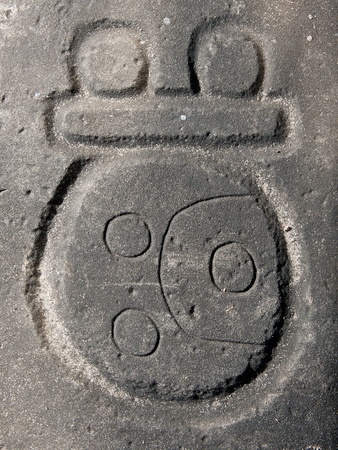 Mayan glyph carved in stone, Nim Li Punit archaeological site, Belize.の写真素材
