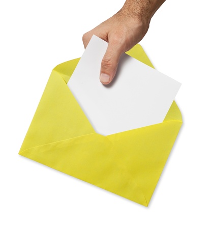 yellow envelope and hand isolated on white background の写真素材