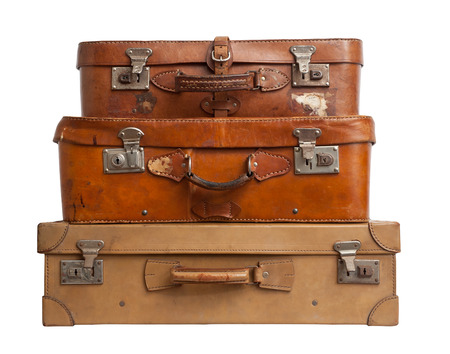 Three vintage suitcases on white backgroundの写真素材