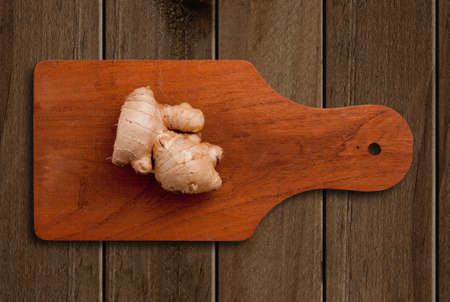 Ginger root  on wooden tableの写真素材
