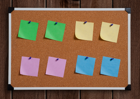note papers on cork boardの写真素材