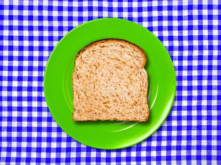 Whole bread slice on plate.の写真素材