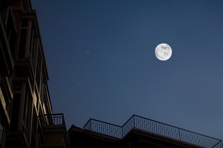 Moon and house roof in night piec.の写真素材