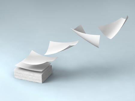 white papers falling up on gray background.の写真素材
