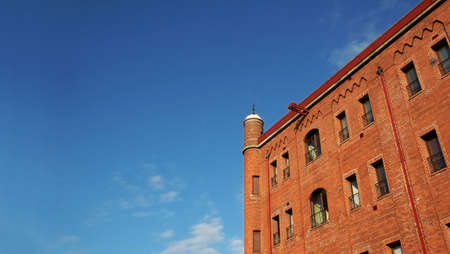 Brick building and blue skyの写真素材