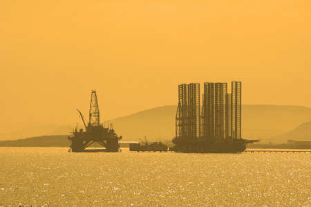 Oil rig during sunset in Baku, Azerbaijan in Caspian Seaの写真素材