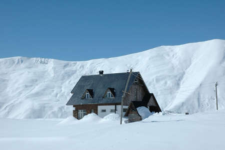 House in mountains during winter