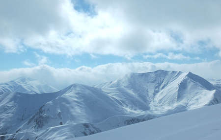 Mountains under the snow in the winterの写真素材