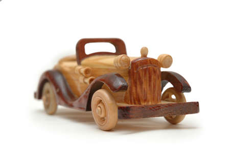 Wooden retro car model isolated on whiteの写真素材