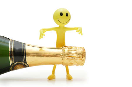 Bottle of champagne and figure of Smileyの写真素材