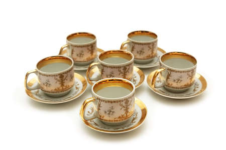 Cups and saucers isolated on white backgroundの写真素材
