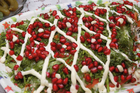 Salad garnished with pomegranate seedsの写真素材