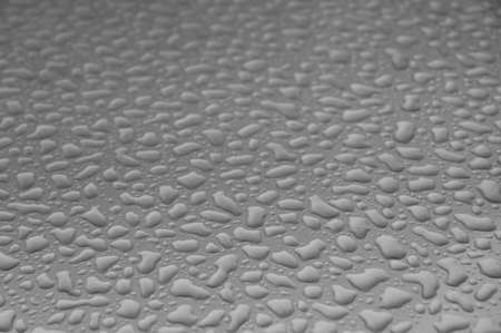 Metal surface evenly covered with water dropsの写真素材