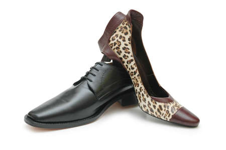 Black male shoe and female shoe isolated on whiteの写真素材