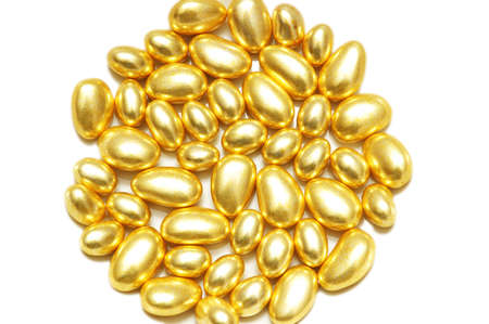 Golden oval shapes arranged at the backgroundの写真素材