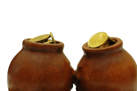 Two clay pots with golden coins isolated on whiteの写真素材