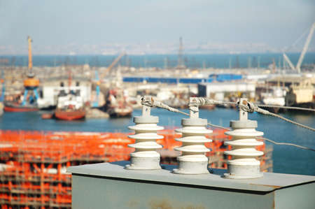 Electricity board and  sea port at the backgroundの写真素材