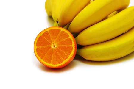Bunch of bananas and orange  isolated on whiteの写真素材