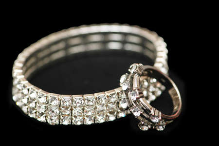 Diamond bracelet and ring isolated  on blackの写真素材