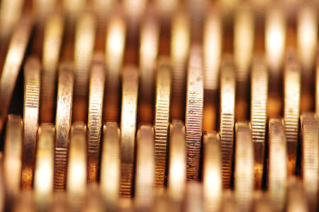Close up of gold coins  in rowsの写真素材