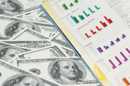 Business bar charts and hundred dollar notesの写真素材