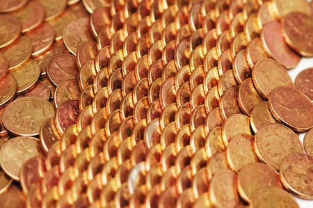 Rows of golden coins  arranged as patternの写真素材