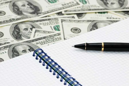 American dollars, ball pen and notebookの写真素材
