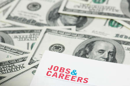 Employment concept  - "Job and careers" words over dollarsの写真素材