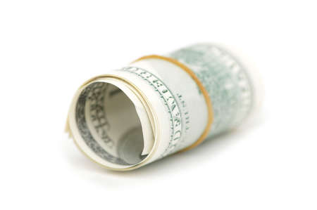 Roll of american dollars isolated on whiteの写真素材