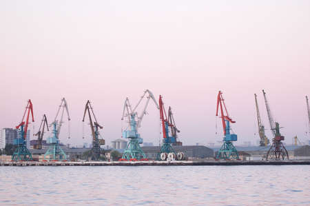 Cranes in Baku port at the eveningの写真素材