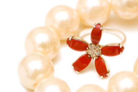 Red ring and pearls isolated on the white backgroundの写真素材