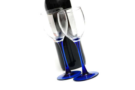 Wine bottle and two empty glasses isolatedの写真素材