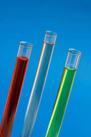 Three retorts in the lab against blue background