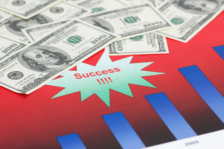 Business concept with dollars over bar chartsの写真素材