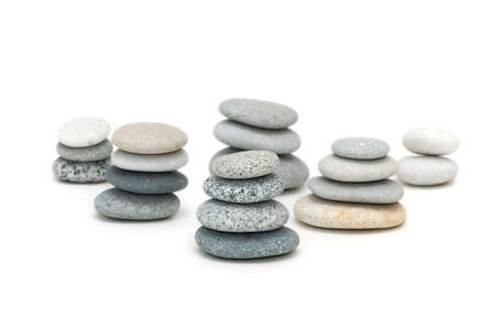 Stacks of pebbles isolated on the whiteの写真素材