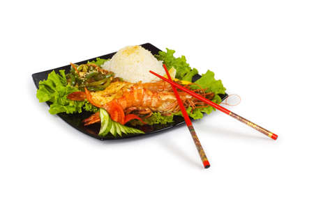 Grilled lobster, rice and vegetables isolated on whiteの写真素材