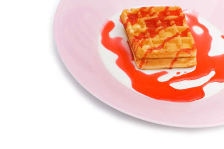 Belgian wafers with strawberry syrup on white