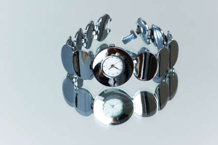 Stylish hand watch on the reflective backgroundの写真素材