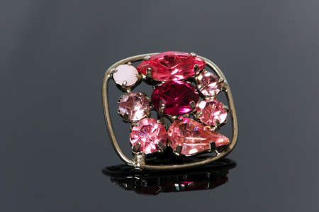 Ring with flower ornament on reflective backgroundの写真素材