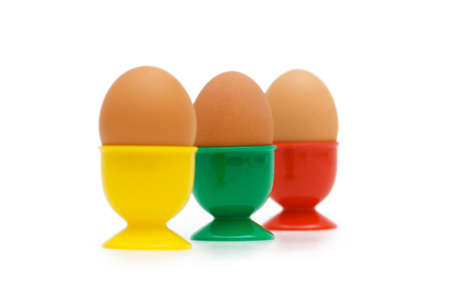 Brown eggs in holder isolated on white