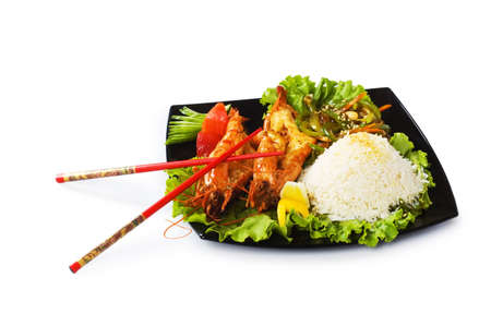 Grilled lobster, rice and vegetables isolated on whiteの写真素材
