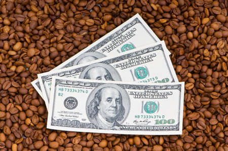 Close up of coffee beans and  dollarsの写真素材